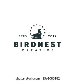 bird and nest logo, vector illustration in a silhouette emblem style
