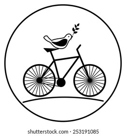 Bird on a bike with a sprig in its beak.