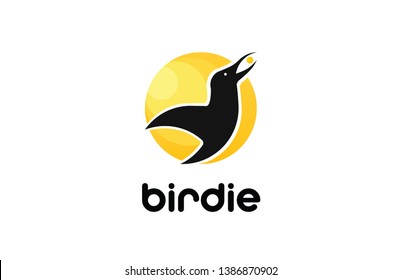 A bird with a pea in the key flies against the rising sun