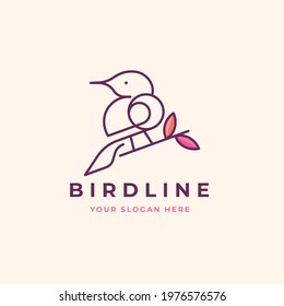 bird perching on a tree branch logo design
