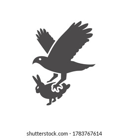 A bird of prey caught a rabbit icon in flat style.Vector illustration.