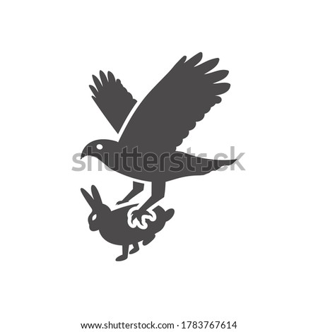 A bird of prey caught a rabbit icon in flat style.Vector illustration.
