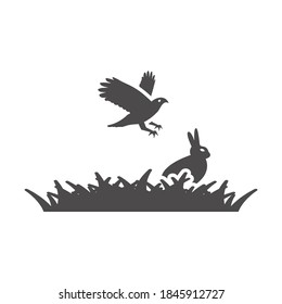 Bird of prey hunt a rabbit in the grass icon.