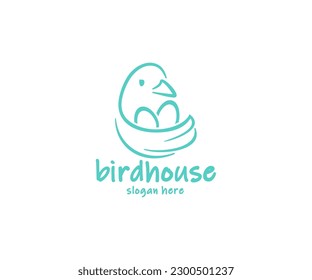 Bird sitting on the nest with eggs logo design. The bird flaps its wing, which looks like a nest graphic design