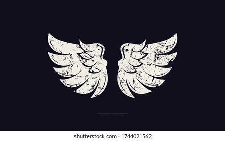 Bird wings silhouette. Design with vintage texture