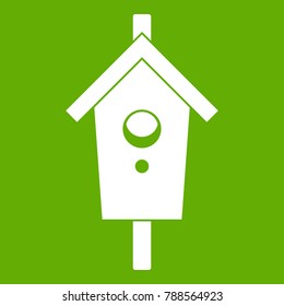 Birdhouse icon white isolated on green background. Vector illustration