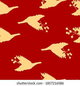 Birds with berries seamless pattern. Illustration of yellow shades. red background. Perfect for Christmas cards, invitations, decorations, textiles and more.
