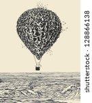 Birds flock in balloon formation flying over the sea