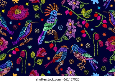 Birds, flowers and berries in the night garden. Seamless vector pattern with embroidered texture. Vintage textile collection.