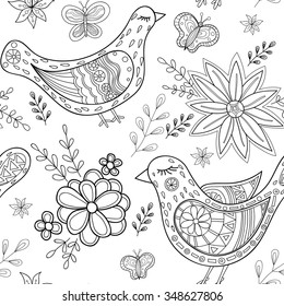 Birds and flowers doodle seamless pattern. Hand-drawn black and white zentangle style background.