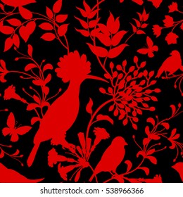 Birds and flowers vector illustration. Unusual motives of nature oriental style. Seamless pattern with image of animals and plants for design of fabrics, paper. Vintage art. Red on black background.