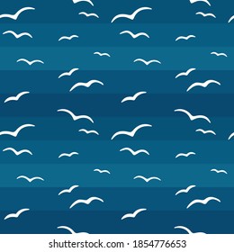 Birds fly across the sky. Seamless pattern. Blue background. Vector graphics.