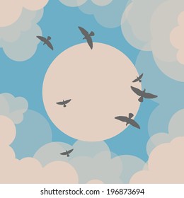 Birds flying in front of the sun