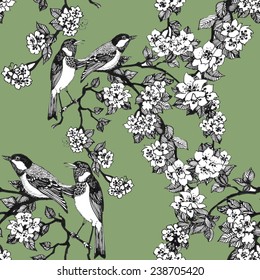 Birds on tree spring twigs Seamless pattern on green background vector illustration