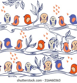 Birds  sitting on a tree branch. Seamless pattern