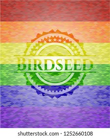 Birdseed on mosaic background with the colors of the LGBT flag