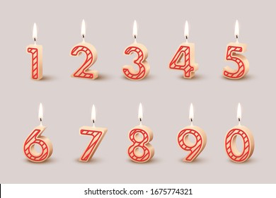 Birthday candles with burning flames isolated on light brown background. Vector design elements