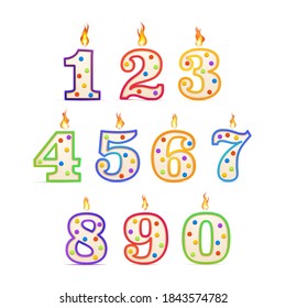 The birthday candles in the different numbers form with fire isolated on white