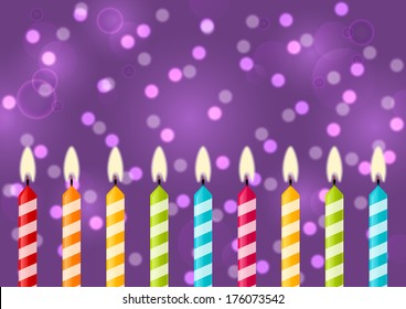Birthday candles on purple background