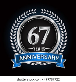 Birthday celebration logo 67 years with wreath, laurel, blue ribbon and silver ring