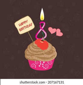 Birthday cupcake with lit candle in shape of number eight