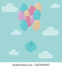 birthday gift with balloons in the sky