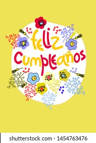 Birthday greeting card in Spanish. Text says Happy Birthday. Hand lettering with floral decoration on golden background