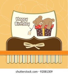 birthday greeting card with teddy bear and big gift box