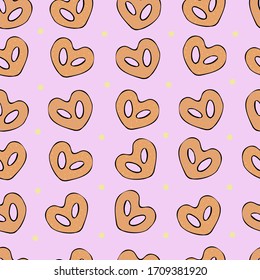 Biscuits in the shape of a heart on a pink background seamless pattern. For fabric, Wallpaper, website, print, cover.