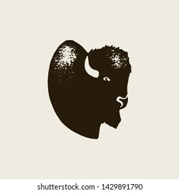 Bison Silhouette Icon. Vector Hand draw bison Symbol of America In Retro style with Grunge Texture on a Light background. Template for logo steak house, farm, t-shirt print and other.