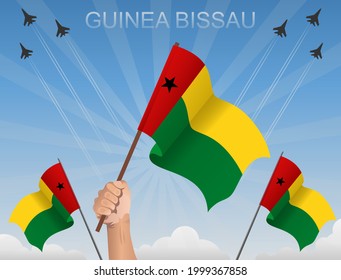 Banderas de Guinea Bissau ondeando bajo el cielo azul