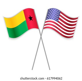 Bissau-Guinean and American crossed flags. Guinea-Bissau combined with United States of America isolated on white. Language learning, international business or travel concept.