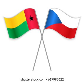 Bissau-Guinean and Czech crossed flags. Guinea-Bissau combined with Czech Republic isolated on white. Language learning, international business or travel concept.