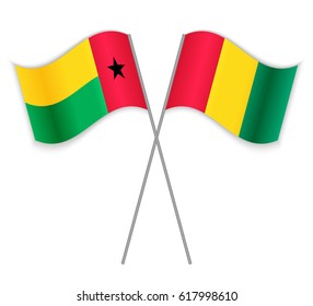 Bissau-Guinean and Guinean crossed flags. Guinea-Bissau combined with Guinea isolated on white. Language learning, international business or travel concept.