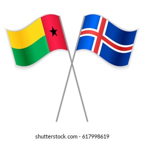 Bissau-Guinean and Icelandic crossed flags. Guinea-Bissau combined with Iceland isolated on white. Language learning, international business or travel concept.