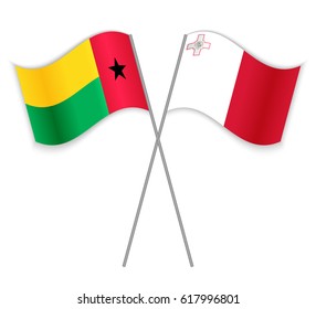 Bissau-Guinean and Maltese crossed flags. Guinea-Bissau combined with Malta isolated on white. Language learning, international business or travel concept.