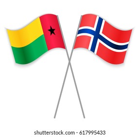 Bissau-Guinean and Norwegian crossed flags. Guinea-Bissau combined with Norway isolated on white. Language learning, international business or travel concept.
