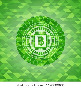 bitcoin chip (cryptocurrency mining concept) icon inside green emblem with triangle mosaic background