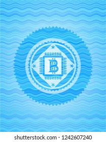 bitcoin chip (cryptocurrency mining concept) icon inside light blue water wave emblem background.