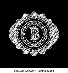 icono de bitcoin dibujado en una pizarra. 