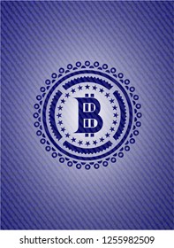 bitcoin icon inside badge with denim texture