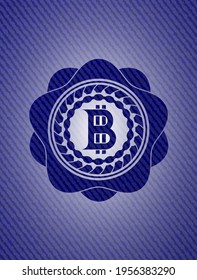 bitcoin icon inside badge with denim texture. 