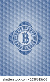 bitcoin icon inside blue emblem with geometric background.