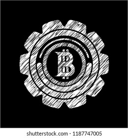 bitcoin icon inside chalk emblem written on a blackboard