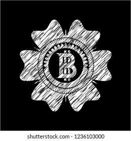 bitcoin icon inside chalk emblem written on a blackboard