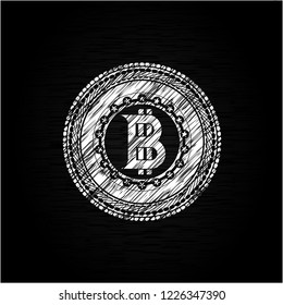bitcoin icon inside chalkboard emblem on black board