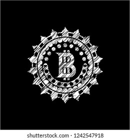 bitcoin icon inside chalkboard emblem on black board