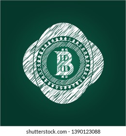 bitcoin icon inside chalkboard emblem on black board
