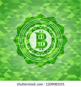 bitcoin icon inside green emblem with triangle mosaic background
