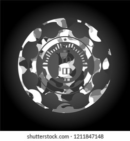 bitcoin icon inside grey camouflage emblem